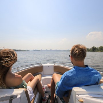 a person sitting on a boat in a body of water in Englewood, Florida